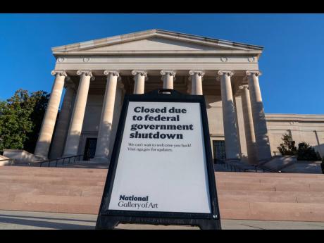 A sign that reads “Closed due to federal government shutdown”, is seen outside of the National Gallery of Art in Washington, October 6, 2025.
