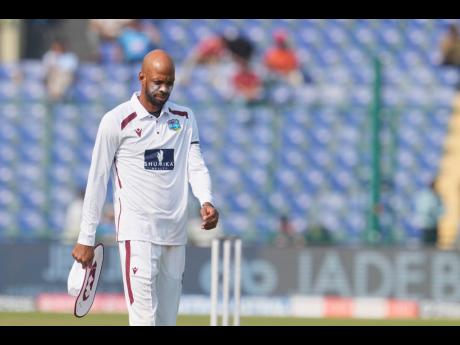 West Indies’ captain Roston Chase walks to his fielding position after bowling on the first day of the second Test match against India at the Arun Jaitley Stadium in New Delhi, India, on Friday.