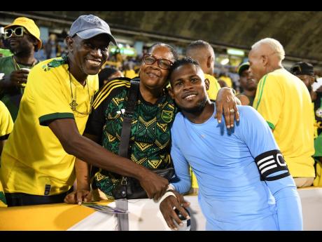 Reggae Boyz Captain Andre Blake (right) with parents George (left) and Coreen Blake.