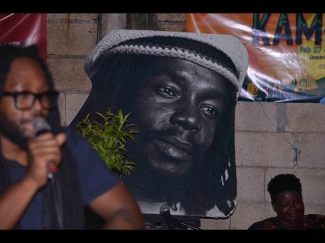 A portrait of Peter Tosh hung up in the yard of The Compound on Tuesday night.