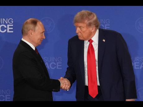 
US President Donald Trump (right) shakes the hand of Russia’s President Vladimir Putin during a joint press conference at Joint Base Elmendorf-Richardson, Alaska, on August 15, 2025.