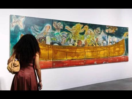 A visitor admires an artwork at Art Basel Miami Beach.