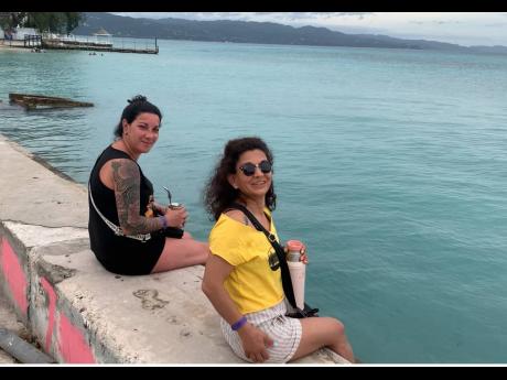 Credit: Photo by Adrian Frater Uruguayan tourists hanging out a Buccaneer Beach in Montego Bay on Monday.