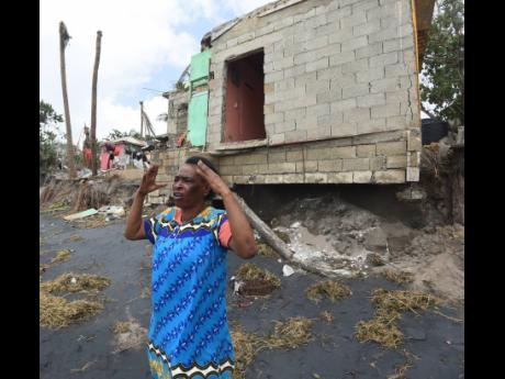 Credit: Ian Allen/Photographer Betty-Lyn Brown, a 60-year-old resident of Compound in Alligator Pond, Manchester, explains how a section of her house got washed awayed during the passage of Hurricane Melissa on Tuesday.