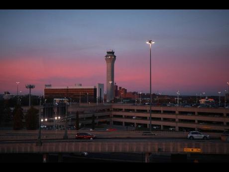 Credit: Andres Kudacki A control tower operates at Newark Liberty International Airport on Friday, November 7, 2025, in Newark, N.J. (AP Photo/Andres Kudacki)