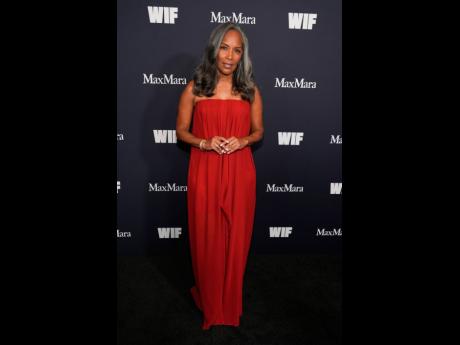 Credit: AP Writer and producer Mara Brock Akil, recipient of the Crystal Award for Advocacy in TV, wore her silver tresses in loose curls, pairing with a red off-the-shoulder dress.
