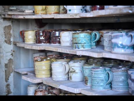 Signature Pinto Pottery mugs are part of the inventory Pinto has stored.