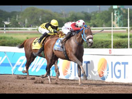 FUNCAANDUN (right), ridden by Tevin Foster, wins The Distinctly Irish Trophy ahead of ATOMICA (Omar Walker) at Caymanas Park on Saturday, August 24, 2024.  