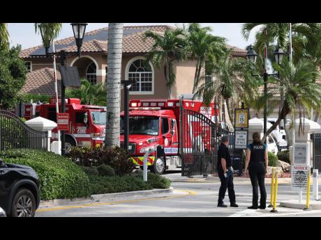 Emergency personnel from Coral Springs and Coconut Creek on scene where a plane crashed in the Windsor Bay community in Coral Springs on Monday, November 10, 2025. (Carline Jean/South Florida Sun-Sentinel via AP)