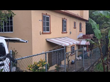 The home of school teacher Tara Pinnock and her daughter Talia Wright in Mount View Estate in Spanish Town, St Catherine, where their bodies were found with stab wounds and their throats slashed on Thursday, November 13, 2025.