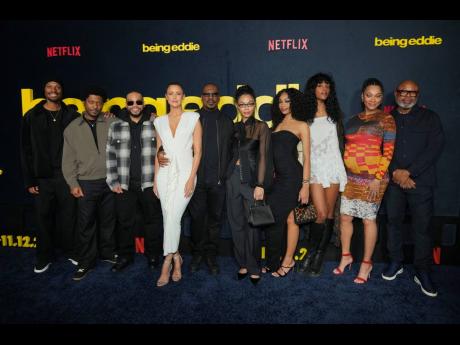 From left: Miles Mitchell Murphy, Christian Murphy, Eric Murphy, Paige Butcher, Eddie Murphy, Bella Murphy, Shayne Audra Murphy, Zola Ivy Murphy and Bria Murphy arrive at the premiere of ‘Being Eddie’ on Wednesday at Netflix Tudum Theater in Los Angele