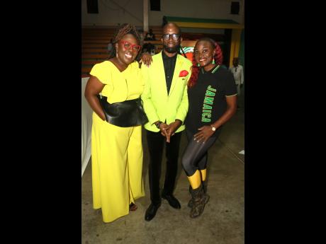 Decked out in their Jamaican colours are (from left) media personalities Nadine Blair, Markland Edwards and Jennifer ‘Jenny Jenny’ Small.