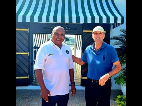 Credit: Contributed Dr Leahcim Semaj shares lens time with Round Hill Hotel and Villas managing director, Josef Fortsmayr, during one of his mindspa workshops for staff at the Montego Bay resort.