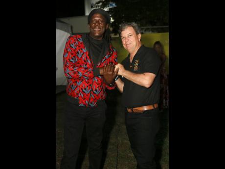 Credit: Nathaniel Stewart Richie Spice greets festival director Jason Henzell, moments after his surprise appearance.