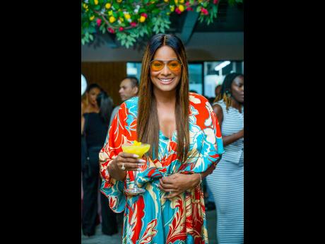 Credit: Contributed Tanya Lee Perkins, head of Leep Marketing, with the Santorini sunset cocktail.