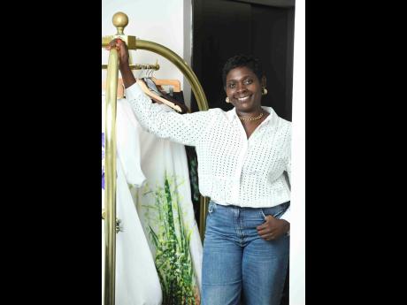 Credit: Antoine Lodge Ahead of the ‘Living’ photo shoot to spotlight her capsule collection, on which she collaborated with visual artist Tobean Walters, fashion designer Angella Wilkinson flashed her pearly whites.