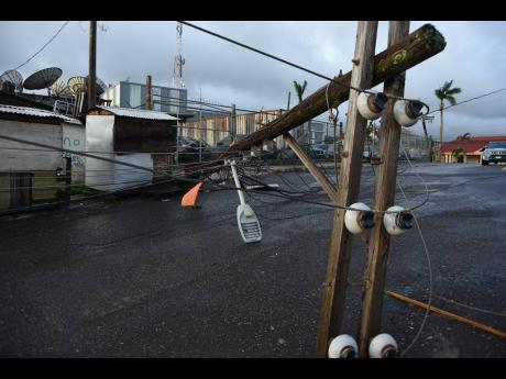 A JPS electricity pole broken by the passage of Hurricane Melissa is seen in Mandeville, Manchester.