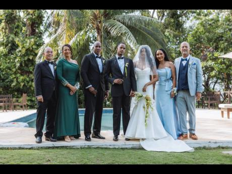 It really takes a village, and the newly-weds (centre) are forever grateful for their parents’ support. From left: the groom’s stepdad, Daren Bayley-Hay; mother Debbie Bayley-Hay; father Anthony Anderson; and the bride’s parents, Donna and John Levy.