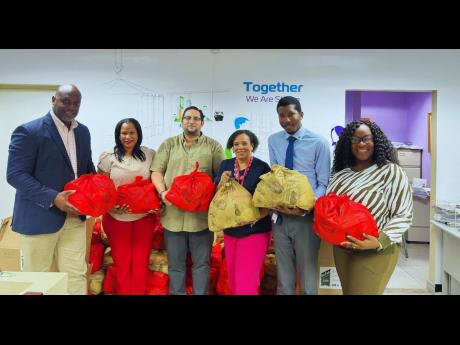  From left: Terrence Brooks, GM, SAJ; Dania Shaw-Smith, sales manager, ZIM–Carib Star; Carlos A. Murillo C., GM, ZIM–Carib Star; Corah Ann Robertson-Sylvester, president, SAJ; Gregory-Paul Campbell, CFO, ZIM–Carib Star; and Natalie Nugent-Soocka, tra