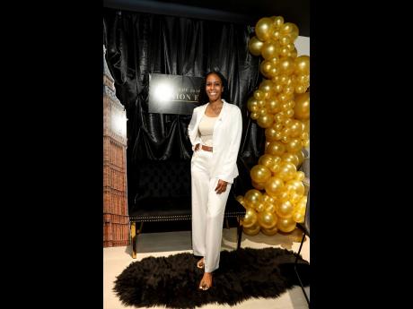 Credit: GERALD A GORDON The lovely Terri-Ann Spencer, financial advisor at Sagicor, who engaged her audience in money matters during her presentation, is all smiles.