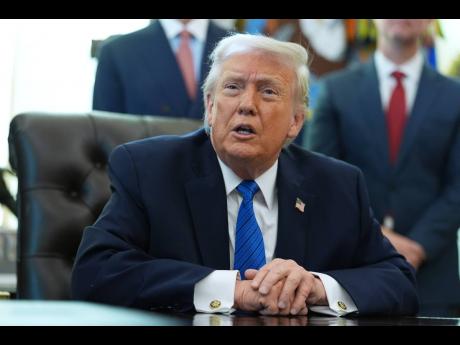 President Donald Trump speaks during an event in the Oval Office of the White House, Friday, January 30, 2026, in Washington. (AP Photo/Evan Vucci)