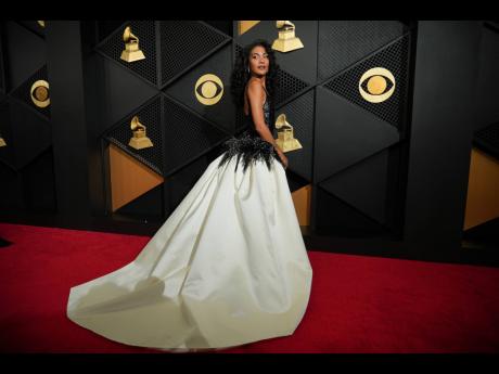 Credit: AP It’s easy to fall in love with this Chanel look worn by Olivia Dean, the newest Best New Artist in town.