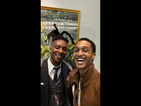 Ahead of their turns on the runway, Jamaican fashion star Romaine Dixon (right) laughed it up with DeAndre Hopkins, wide receiver for the Baltimore Ravens, who was Look 3 in the model line-up.