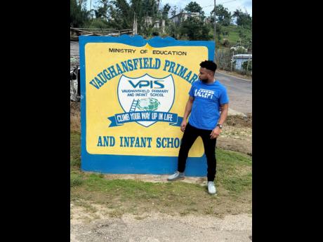 Peter Ivey, founder of Mission:FoodPossible, stands beside the entrance to Vaughansfield Primary and Infant School.