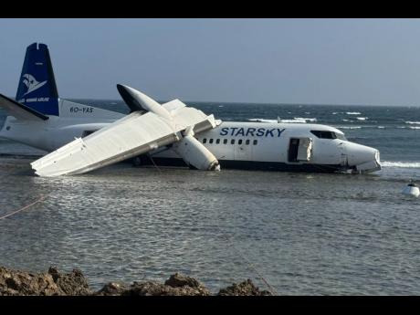 An aircraft carrying up to 50 people on the shoreline after veering off the runway during an emergency crash-landing at Somalia’s main airport in Mogadishu, Somalia, Tuesday, February, 2026.  