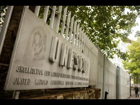 A man enters the UNESCO headquarters Tuesday, July 22, 2025 in Paris.