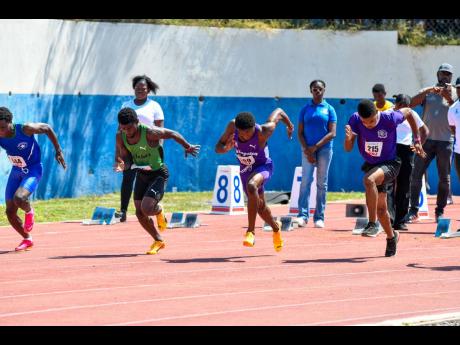Athletes break from the starting blocks at last year’s Corporate Area Athletics Championships at Jamaica College’s Ashenheim Stadium.