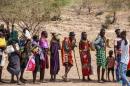 Locals queue to receive relief food as severe drought continues, in Lomekulu Village, Turkana County, Kenya, Sunday, February 8, 2026. 